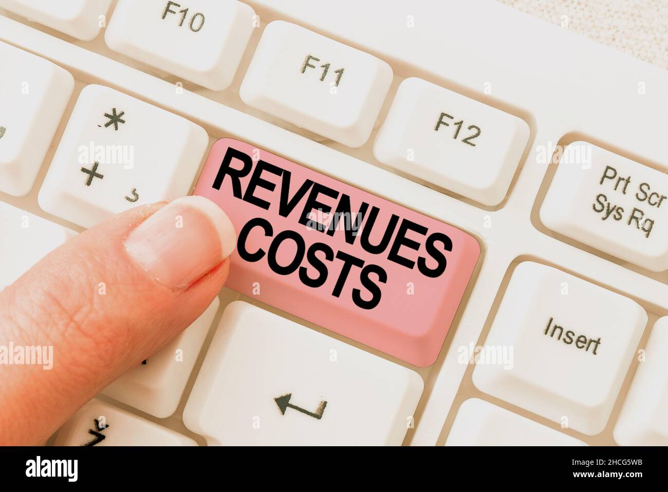 Text caption presenting Revenues Costs. Business approach Total amount of money in Manufacturing and Delivery a product Typing Advance Lesson And Stock Photo