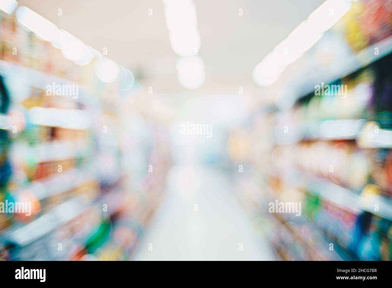 Abstract blurred row of goods on shelf in supermarket, Business ...