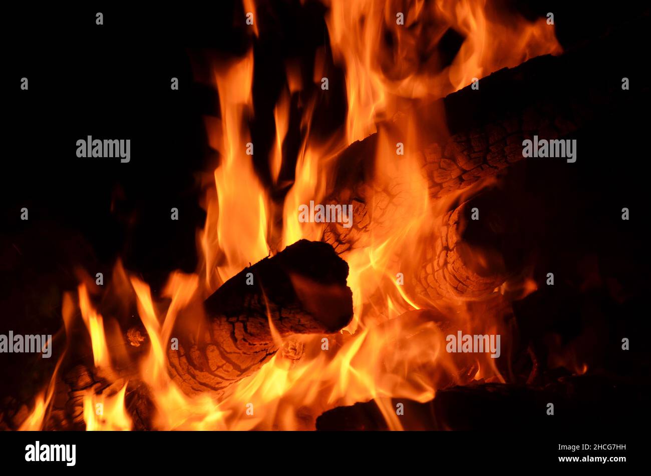 logs burning on an open fire Stock Photo
