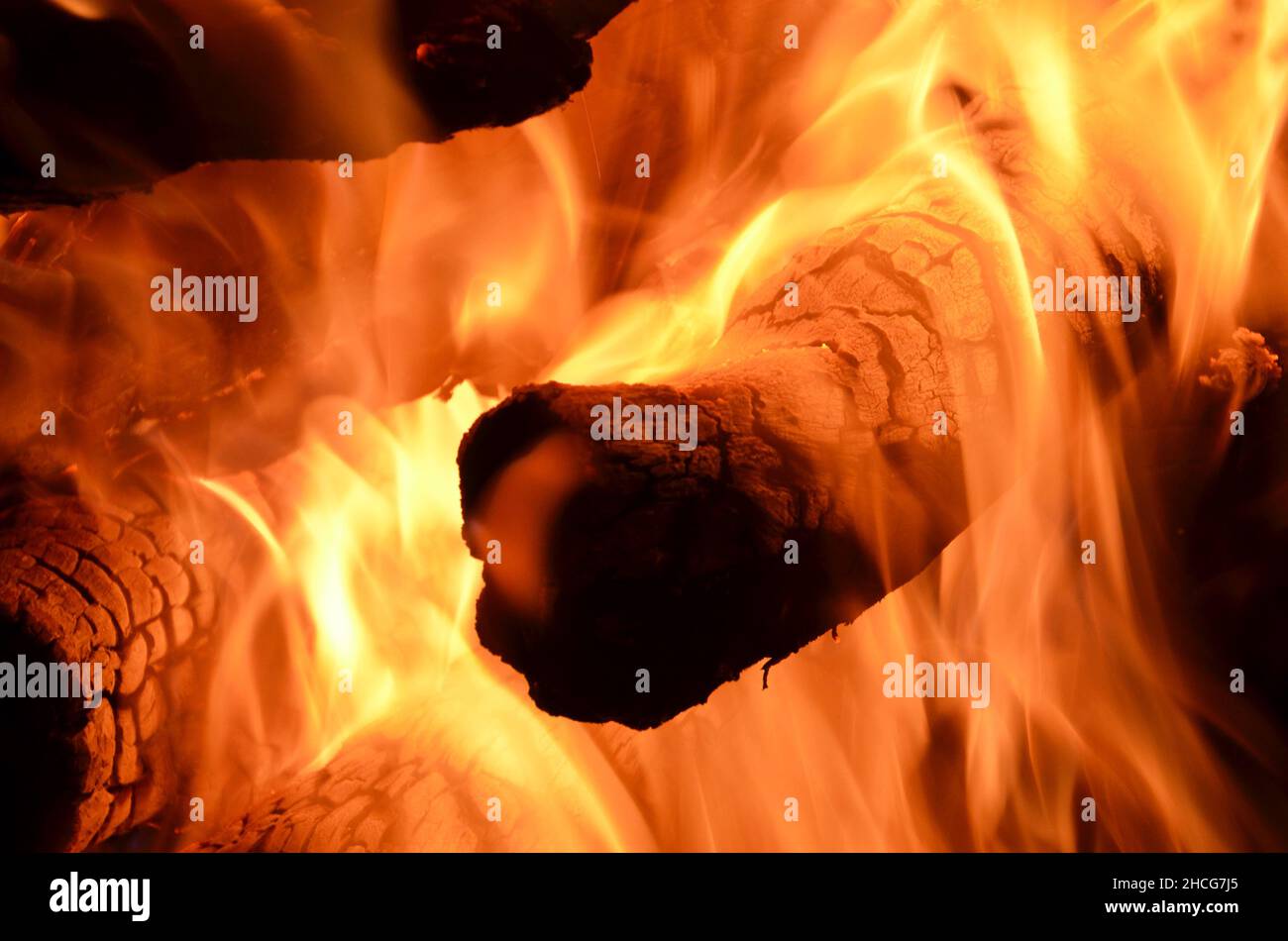 logs burning on an open fire Stock Photo