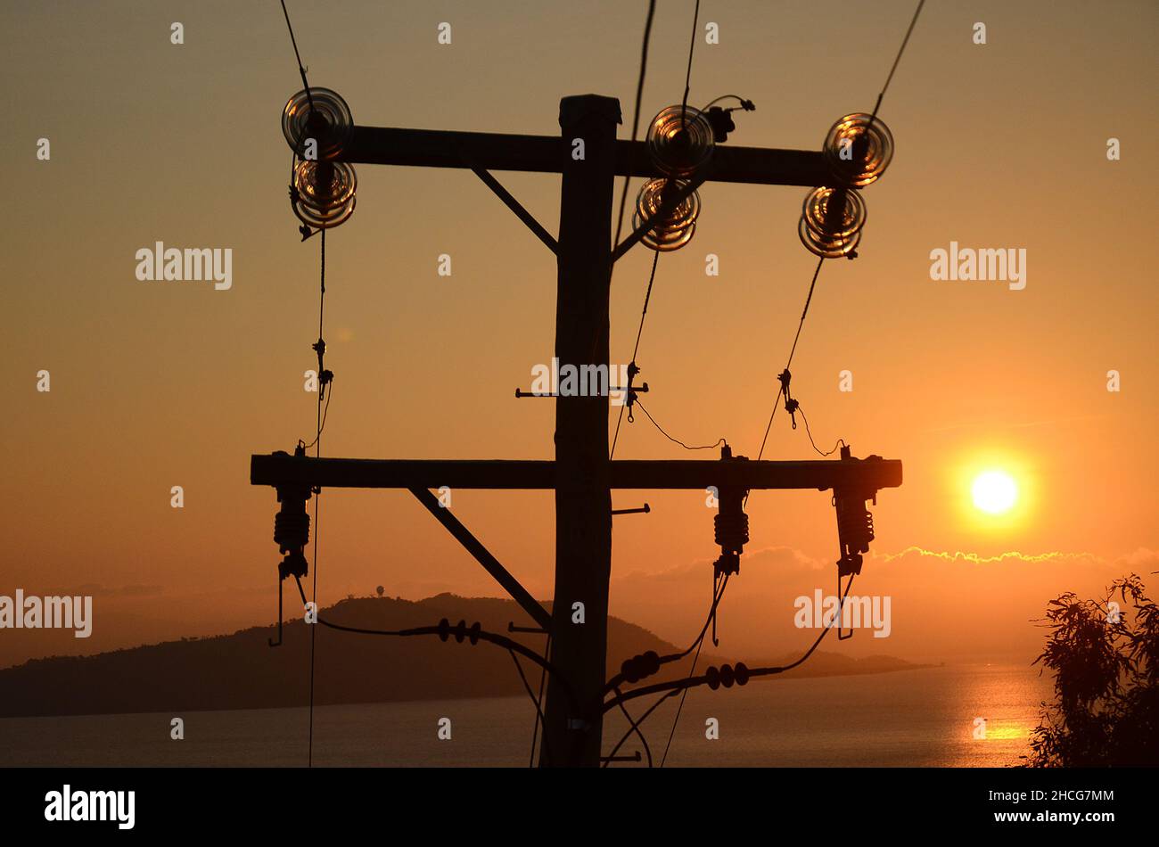 electric power lines at sunset Stock Photo