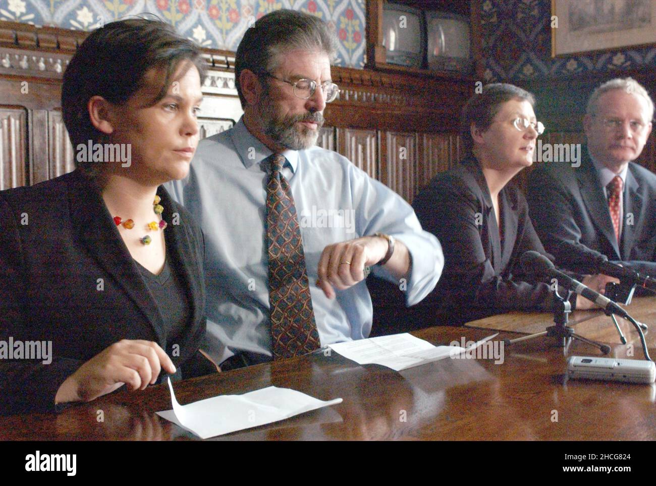 File photo dated 3/04/04 of the then Sinn Feinn President Gerry Adams (2nd left) with Barbara De Bruin (left) and party chief negotiator Martin McGuiness (right) during a news conference. Sinn Fein raised security concerns with the Government about housing Northern Ireland's new Assembly at Stormont, according to newly released documents from the National Archives. Issue date: Wednesday December 29, 2021. Stock Photo