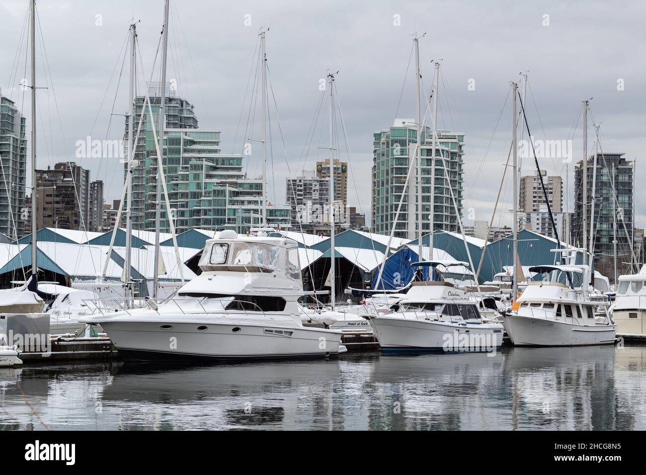 Vancouver British Columbia, Canada. Winter cityscape of Vancouver with yachts and boats in the harbour-December 26, 2021. Nobody, street view, selecti Stock Photo