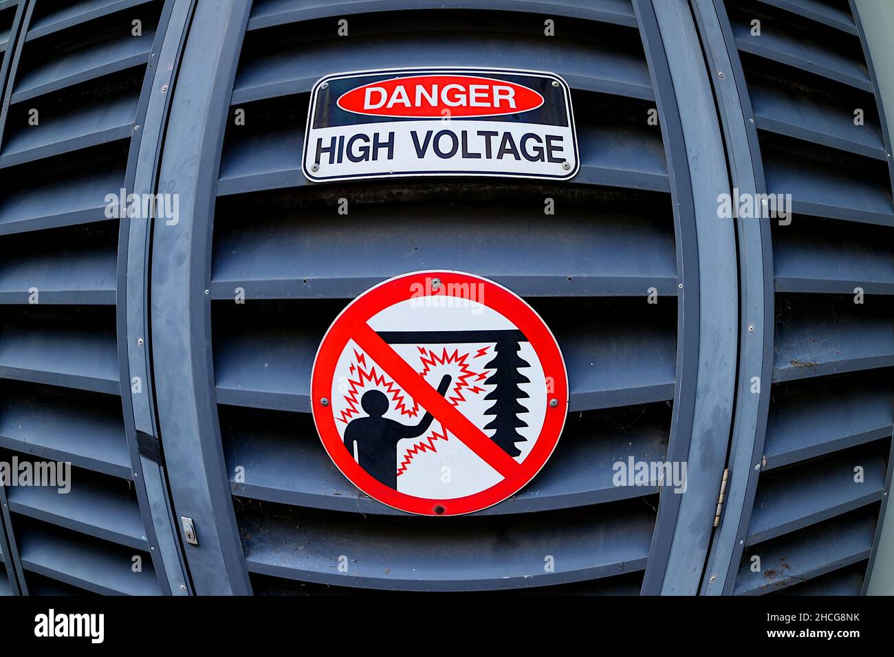 Fish eye view of Danger High Voltage signage at power station Stock Photo