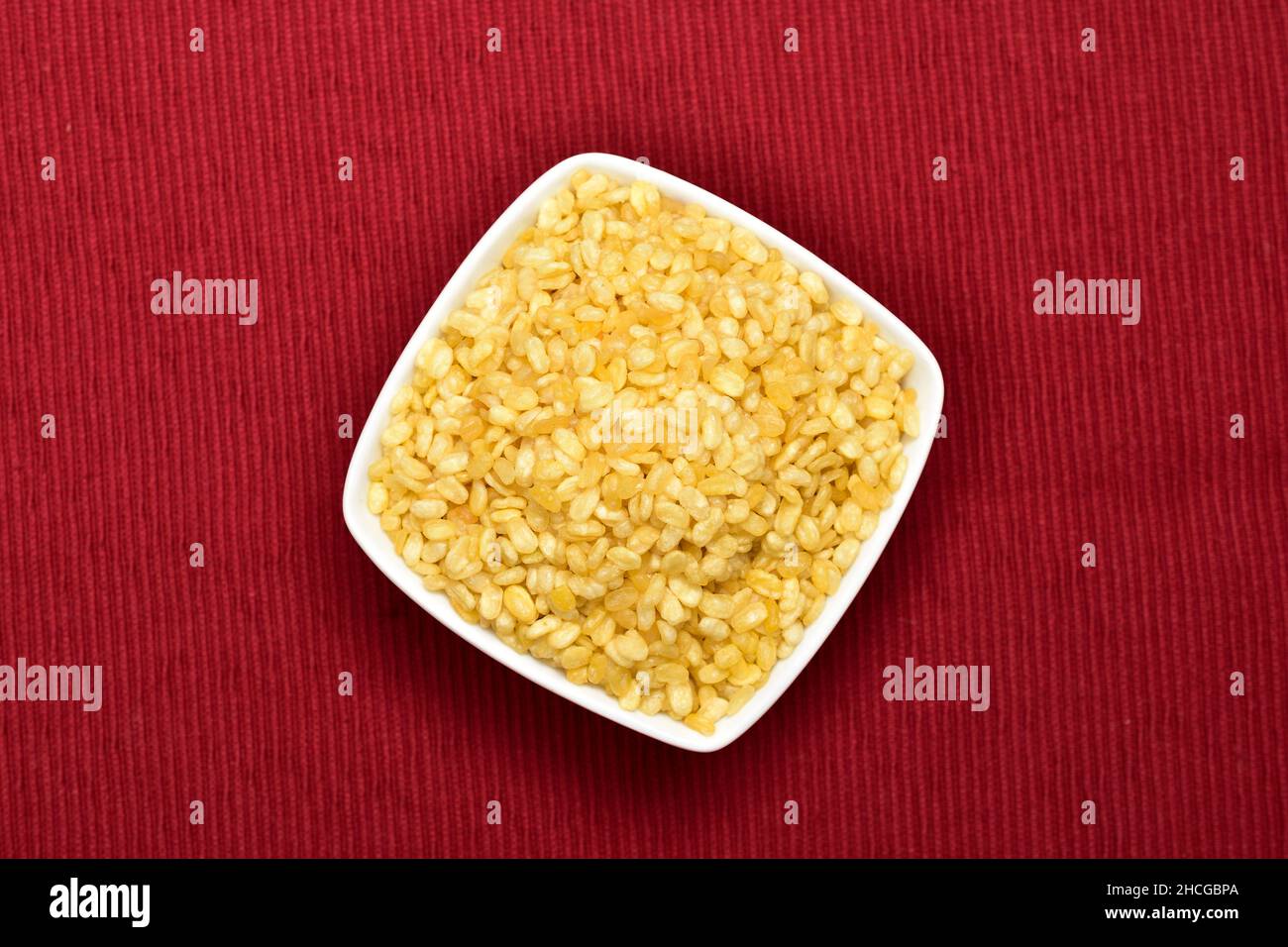 Top View of Mung Dal Namkeen in Bowl on Red Placemat Cloth Stock Photo
