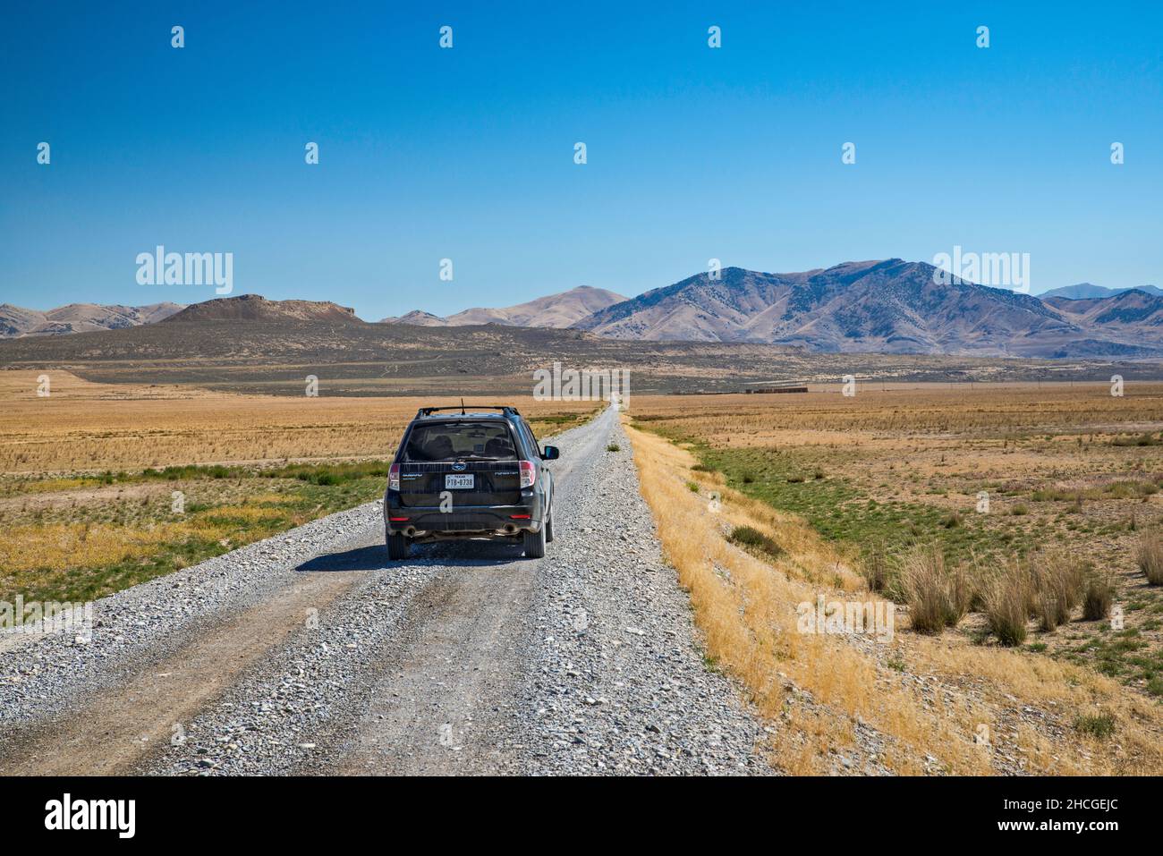 Transcontinental Railroad Byway, Central Pacific Railroad grade, North Promontory Mountains in distance, Golden Spike National Historical Park, Utah Stock Photo