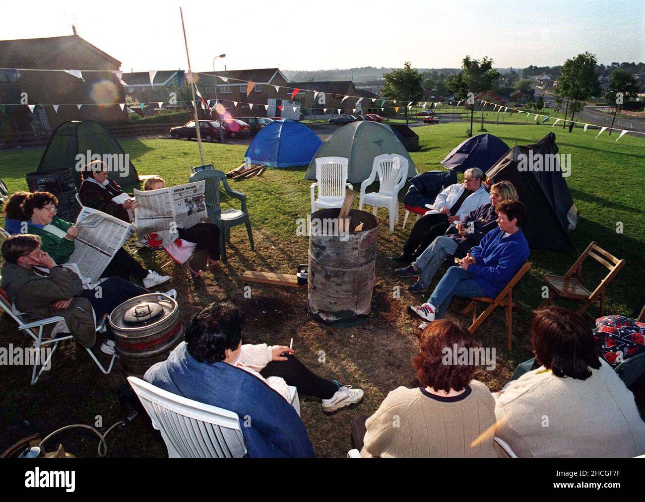 File photod ated 05/07/97 of a dawn vigil for Catholic residents of the Garvaghy Road in Portadown where they set up a peace camp to try and prevent an Orange March along the Road from Drumcree Church. An Irish Government official asked an NIO minister about speculation that the British Army was 'measuring' the Garvaghy Road in Portadown for bollards at the height of the marching dispute in 1997, according to newly released documents from the National Archives. Issue date: Wednesday December 29, 2021. Stock Photo