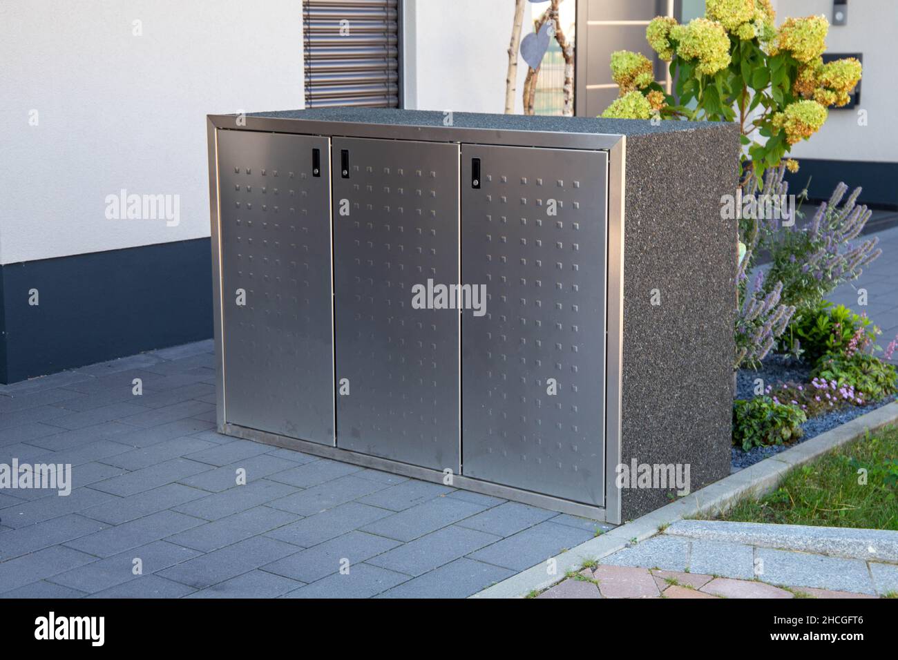 Garbage can storage, Garbage bin storage Stock Photo Alamy