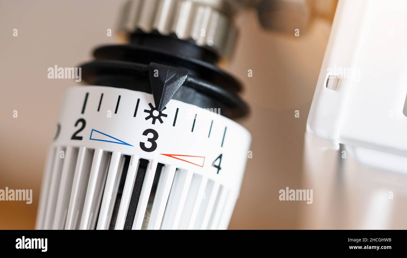 thermostatic radiator valve set to middle temperature, symbol for