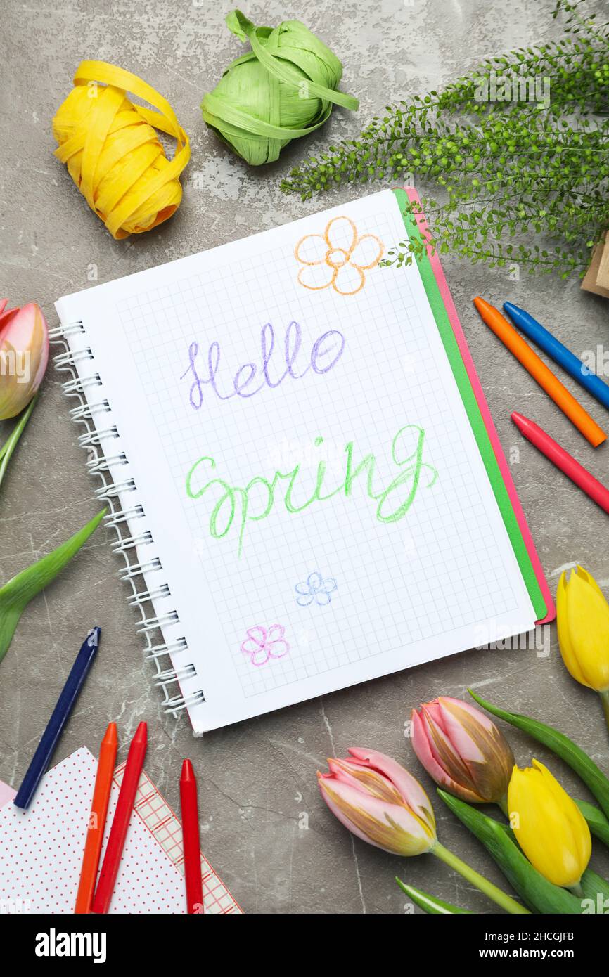Hello spring concept on gray textured background Stock Photo