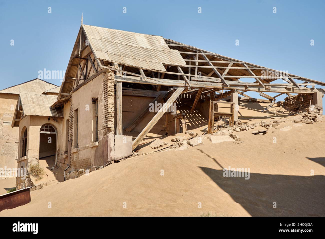 Nature takes over ruin house in Namib desert, Kolmanskop ghost town, Namibia, Africa Stock Photo