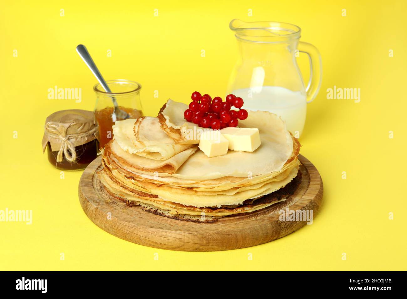 Concept of tasty food with crepes on yellow background Stock Photo - Alamy