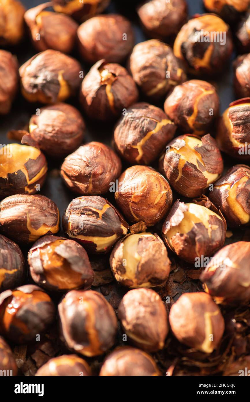 Hazelnuts roasted in an oven. Close up. Stock Photo