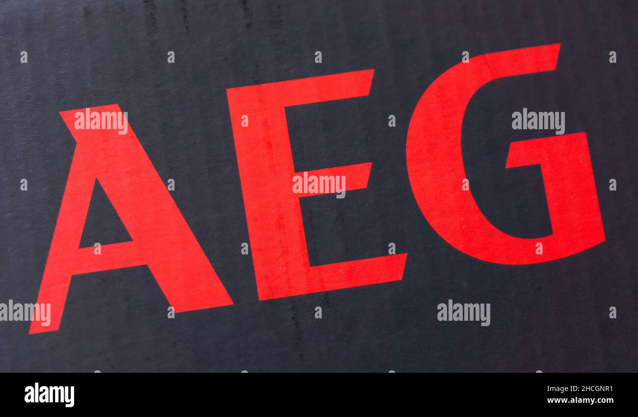 The logo of the brand 'AEG' printed on a black parcel. Allgemeine Elektricitaets-Gesellschaft was German producer of electrical equipment, in 2005 now Stock Photo