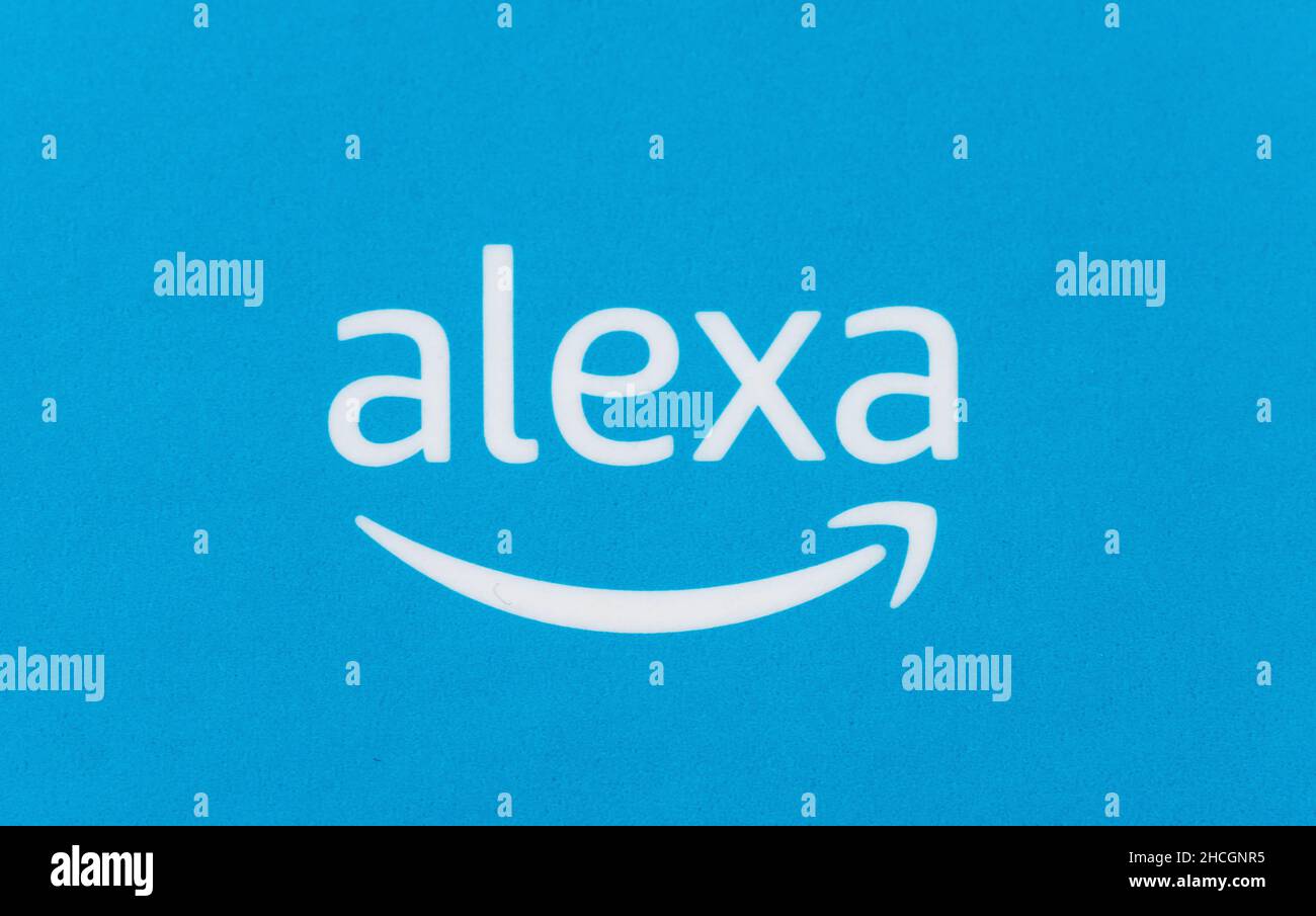Amazon Alexa logo on a blue parcel background. Amazon's Echo Dot, Alexa is a virtual assistant Smart Home Echo Voice Service from Amazon. Stock Photo