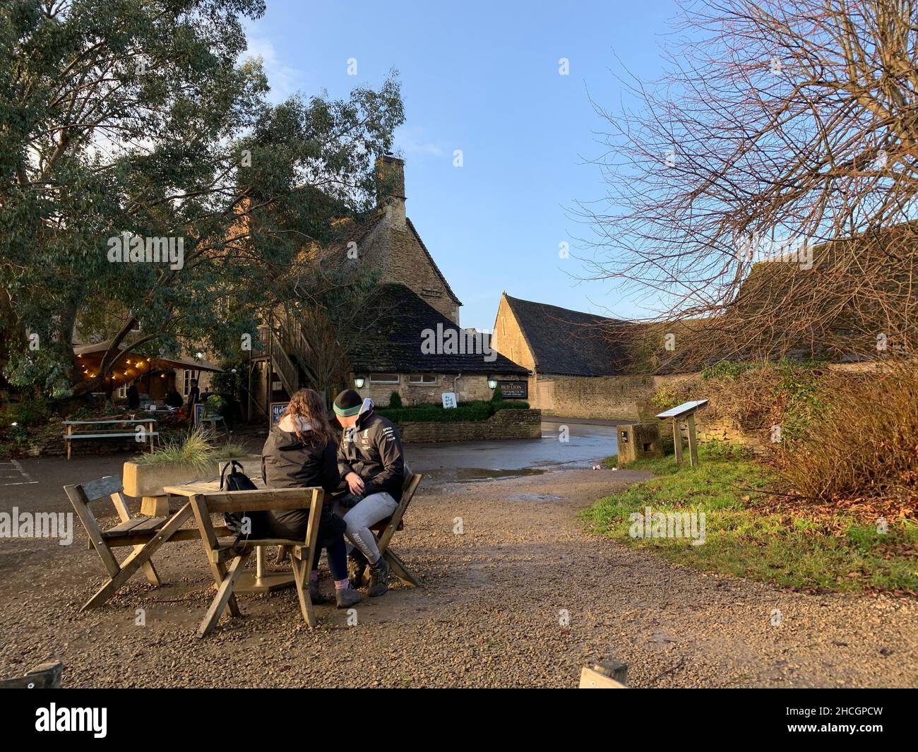 Pub garden in Laycock village and Laycock abbey Wiltshire UK bench