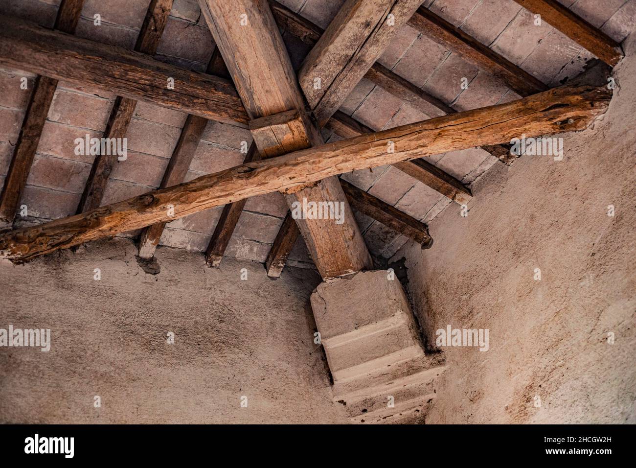 Wooden beams on the ceiling of an old and abandoned building Stock Photo