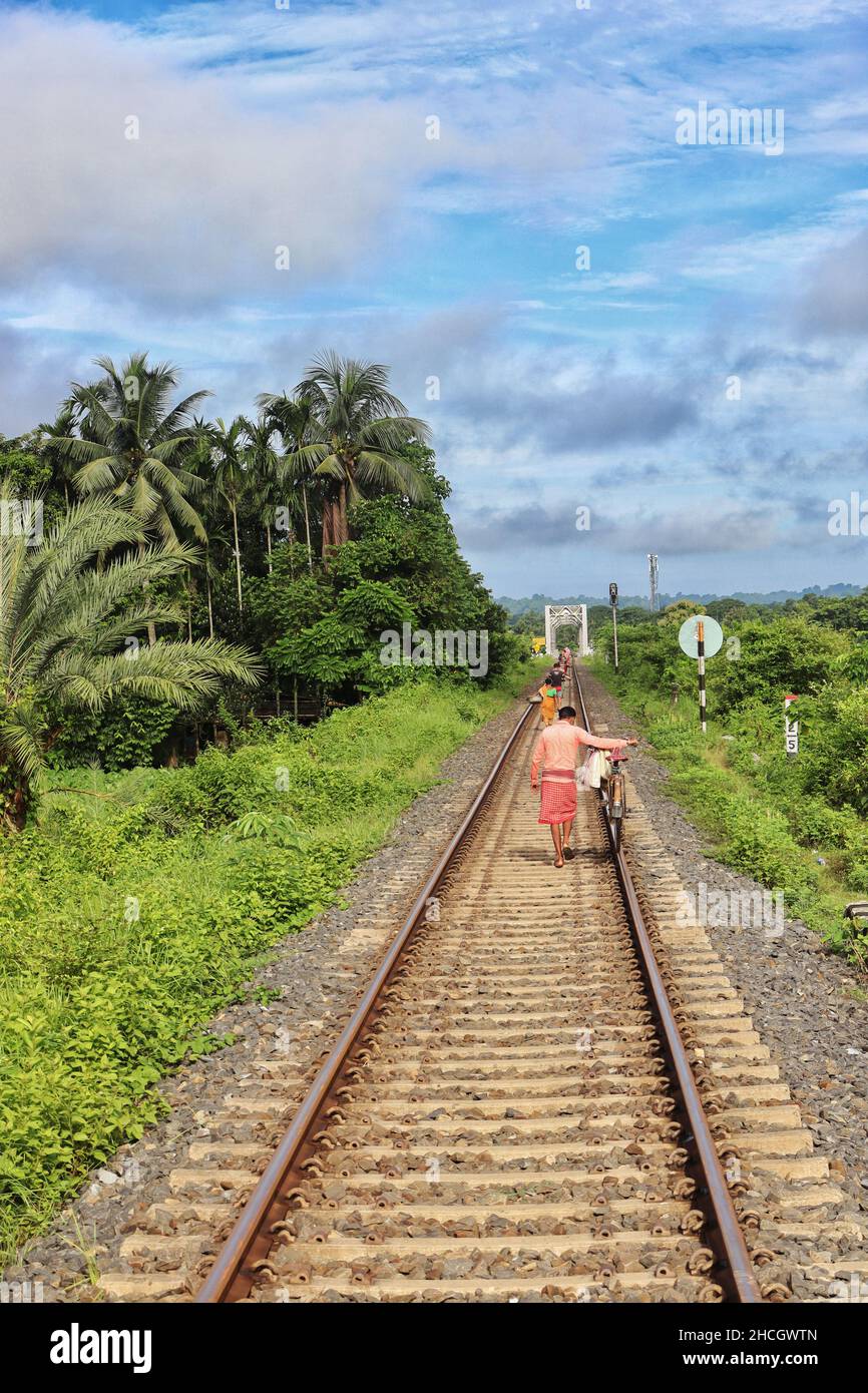 People walking on the railway track Stock Photo