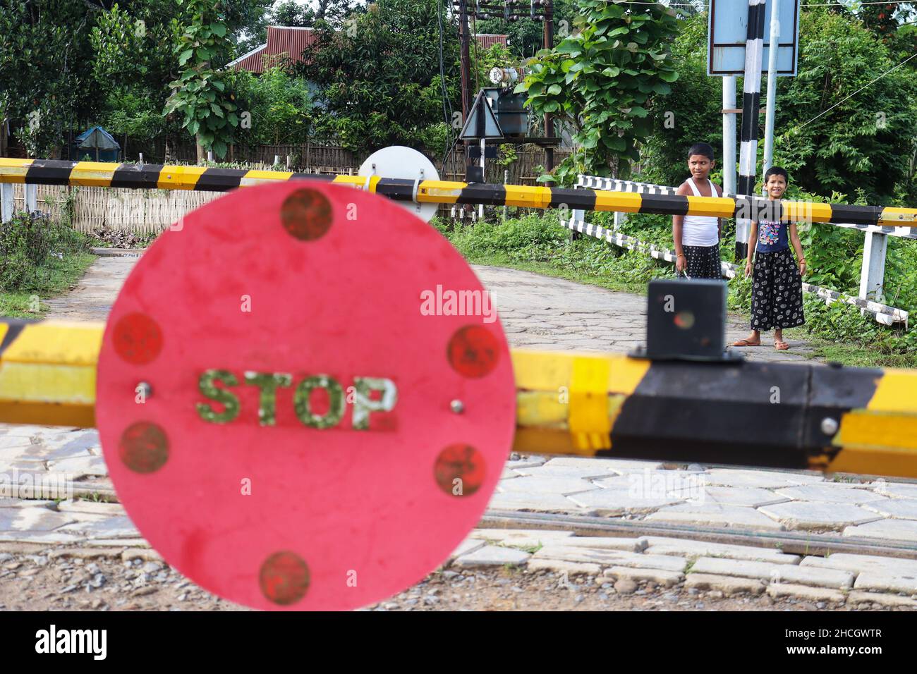 Two Child waiting for crossing the railway track after the rail crossed