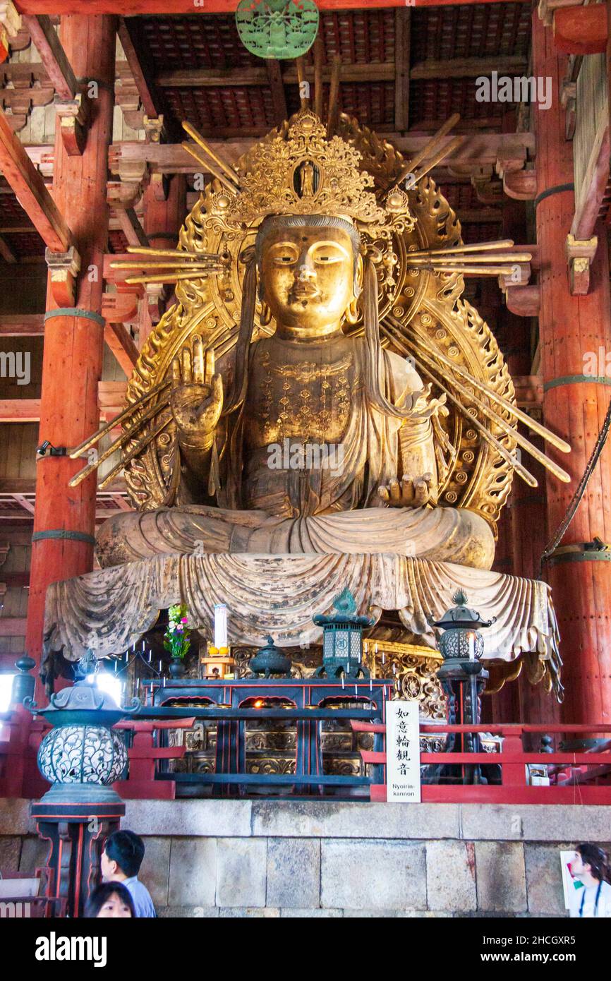 The seated Niyorin kannon statue in the Great Buddha hall, Daibutsu, at the Todai-ji temple complex in Nara, Japan. Stock Photo