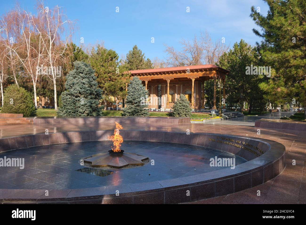 The eternal fire flam and wailing mother statue. At Memorial Square in Tashkent, Uzbekistan. Stock Photo