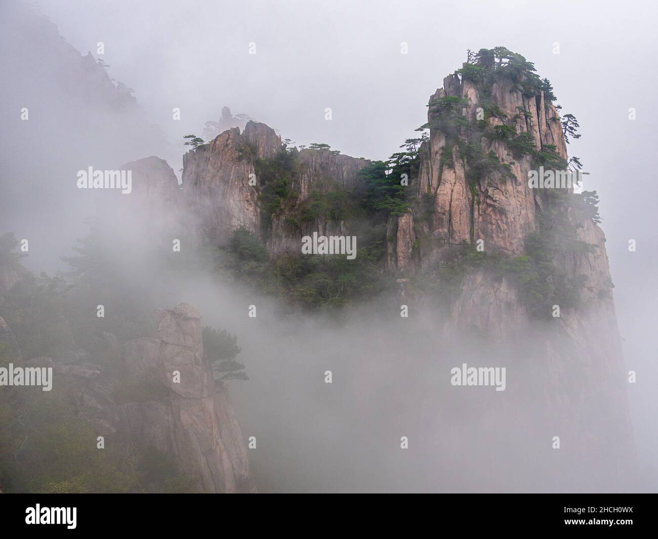 mist and fog covering the Huangshan mountains, yellow mountains, Anhui, Huangshan, China, asia, stock photo Stock Photo