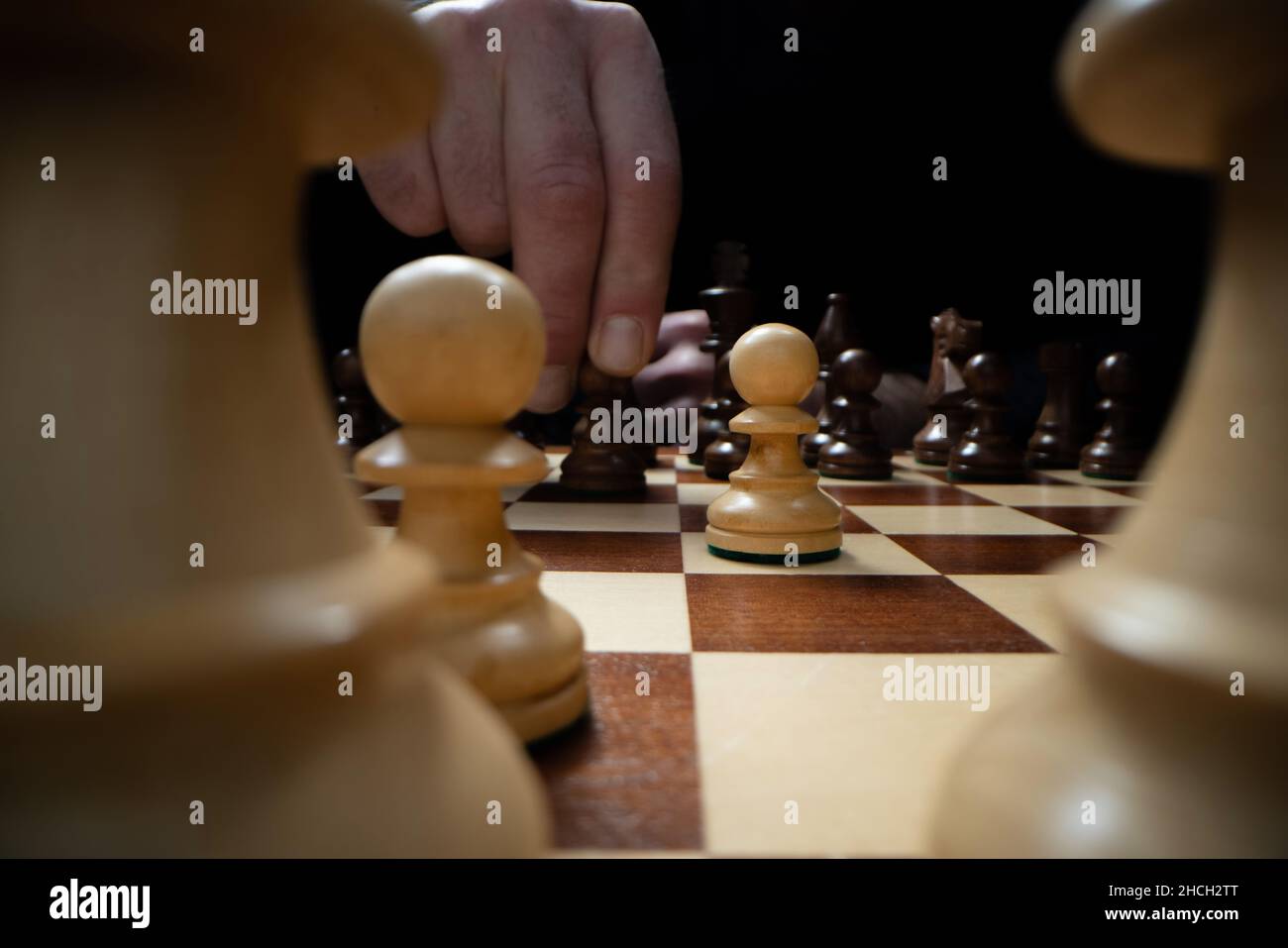 brown chess board with figures on a wooden table in a cafe, playing chess  Stock Photo - Alamy