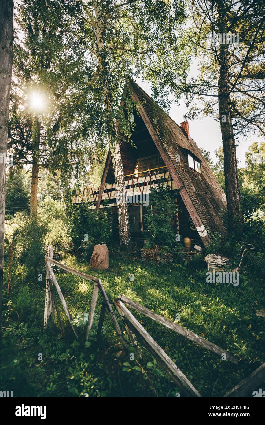 Bush Ranger Hut A vertical view of a triangular ranger hut in the middle of the taiga ...