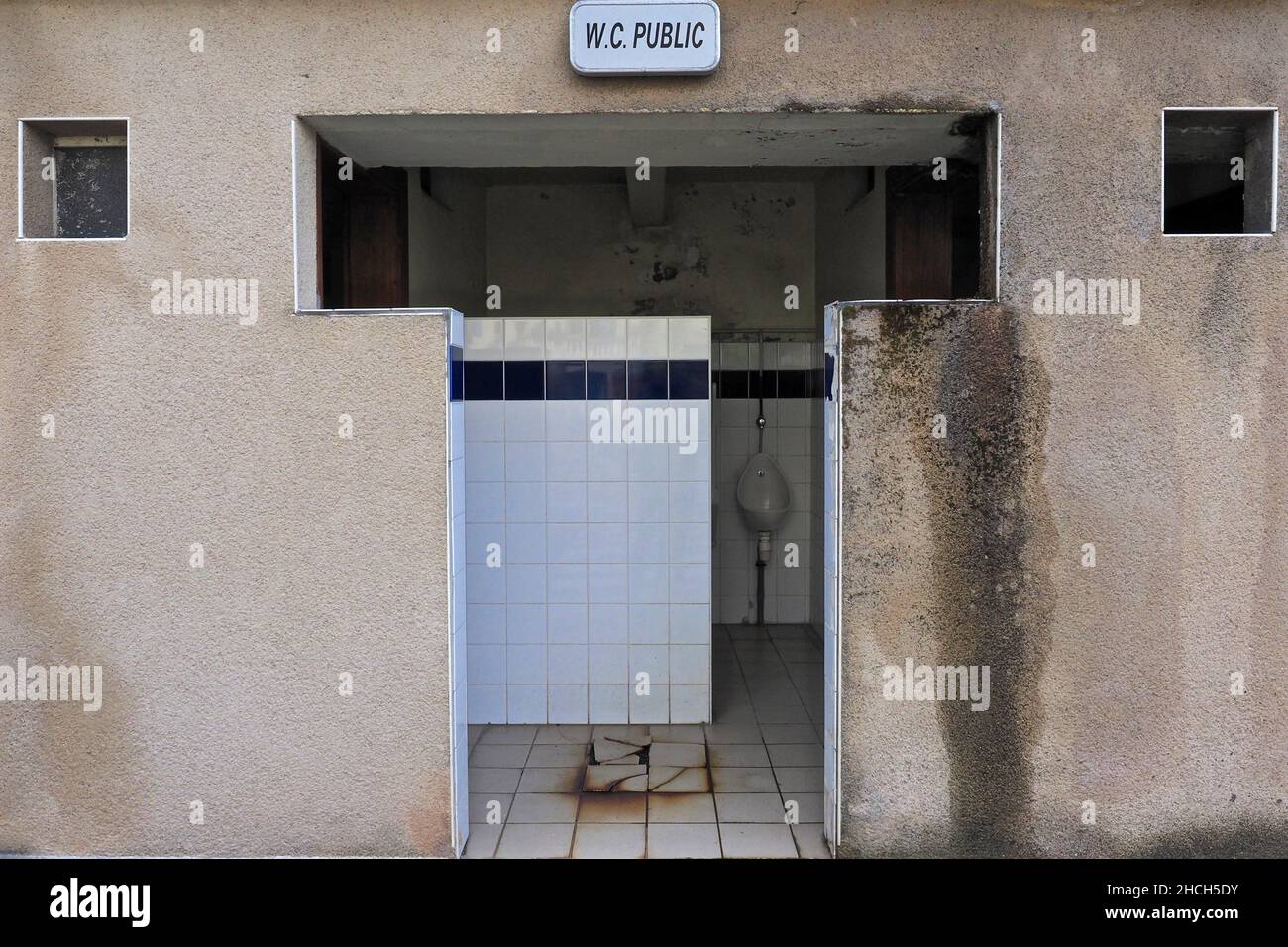 Public toilet with urinal, France Stock Photo
