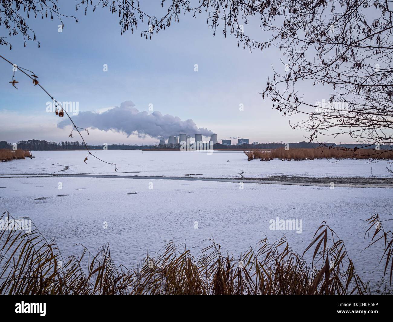 Winter pond landscape with power plant Stock Photo