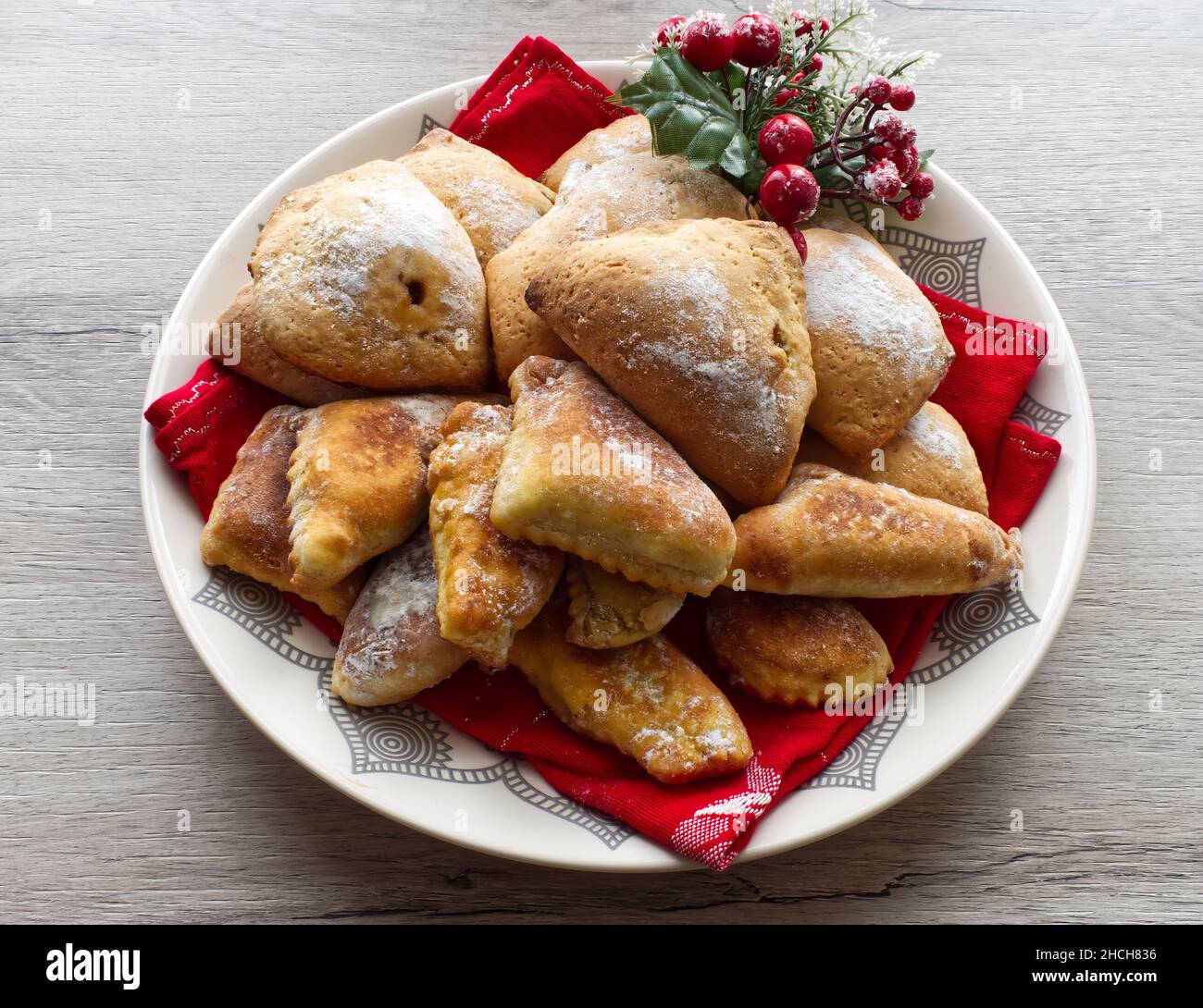 Italian sweet Tortelli di Natale with jam. Traditional Italian dessert for Christmas. Stock Photo