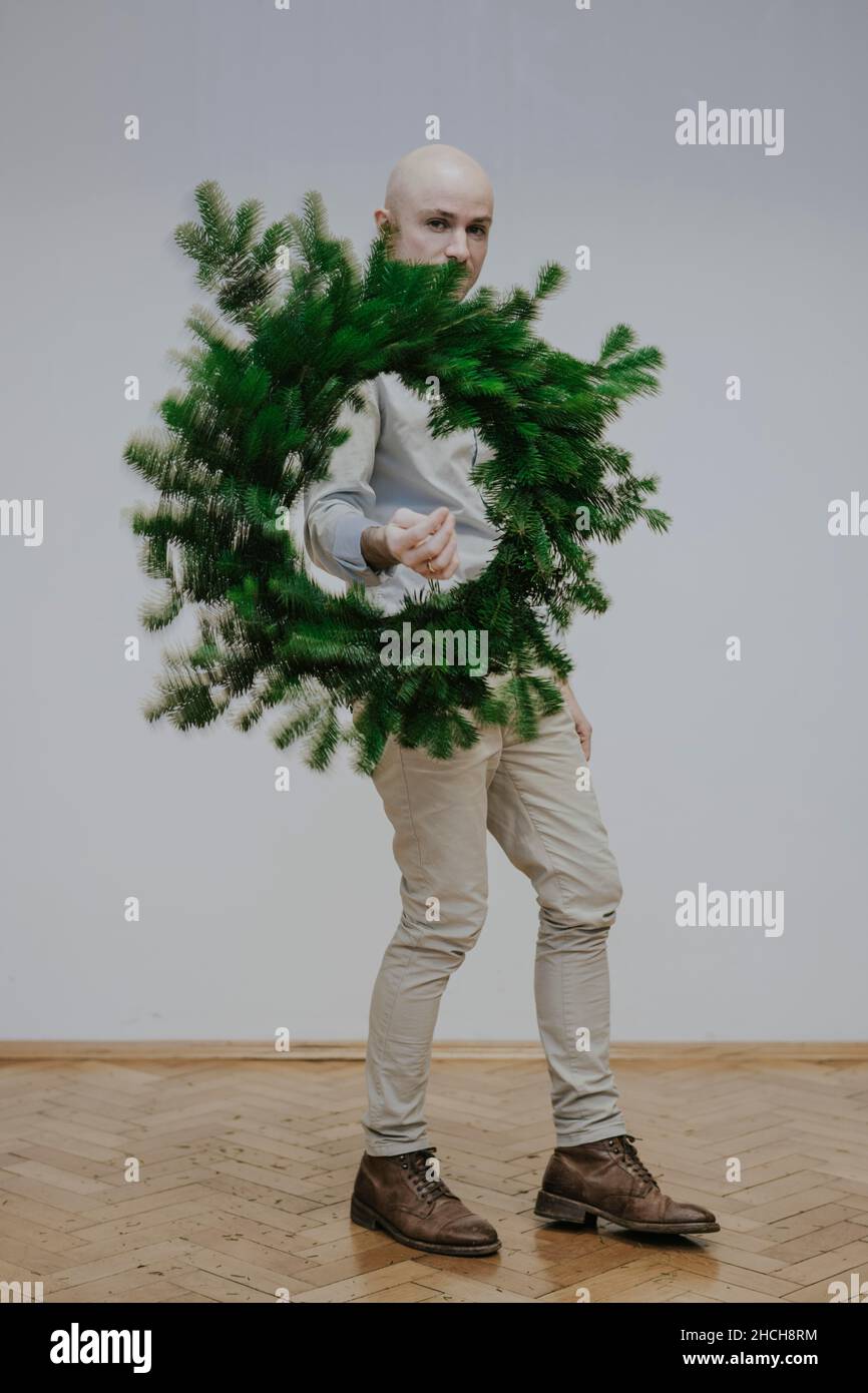 Man with fir wreath Stock Photo