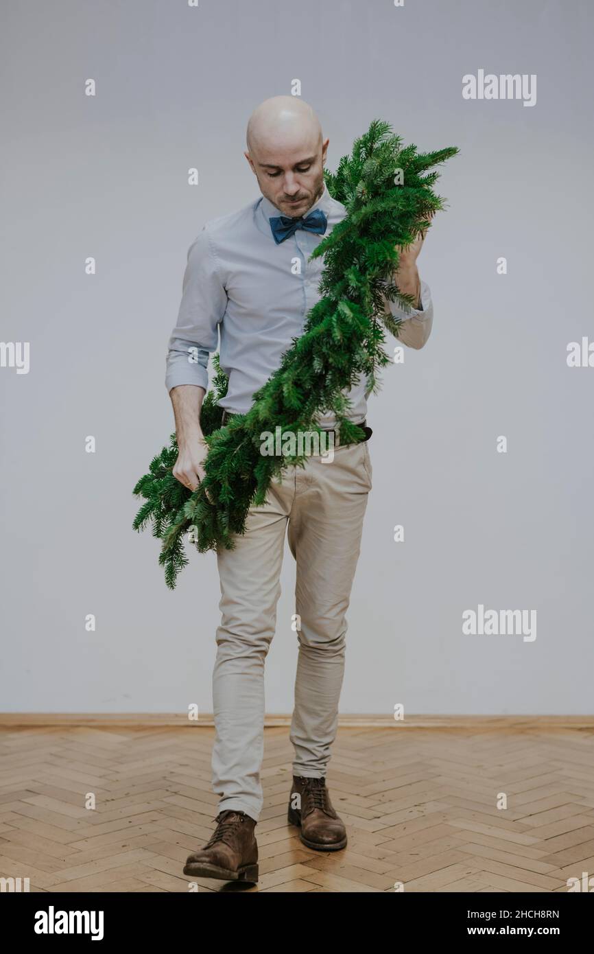Man with fir wreath Stock Photo