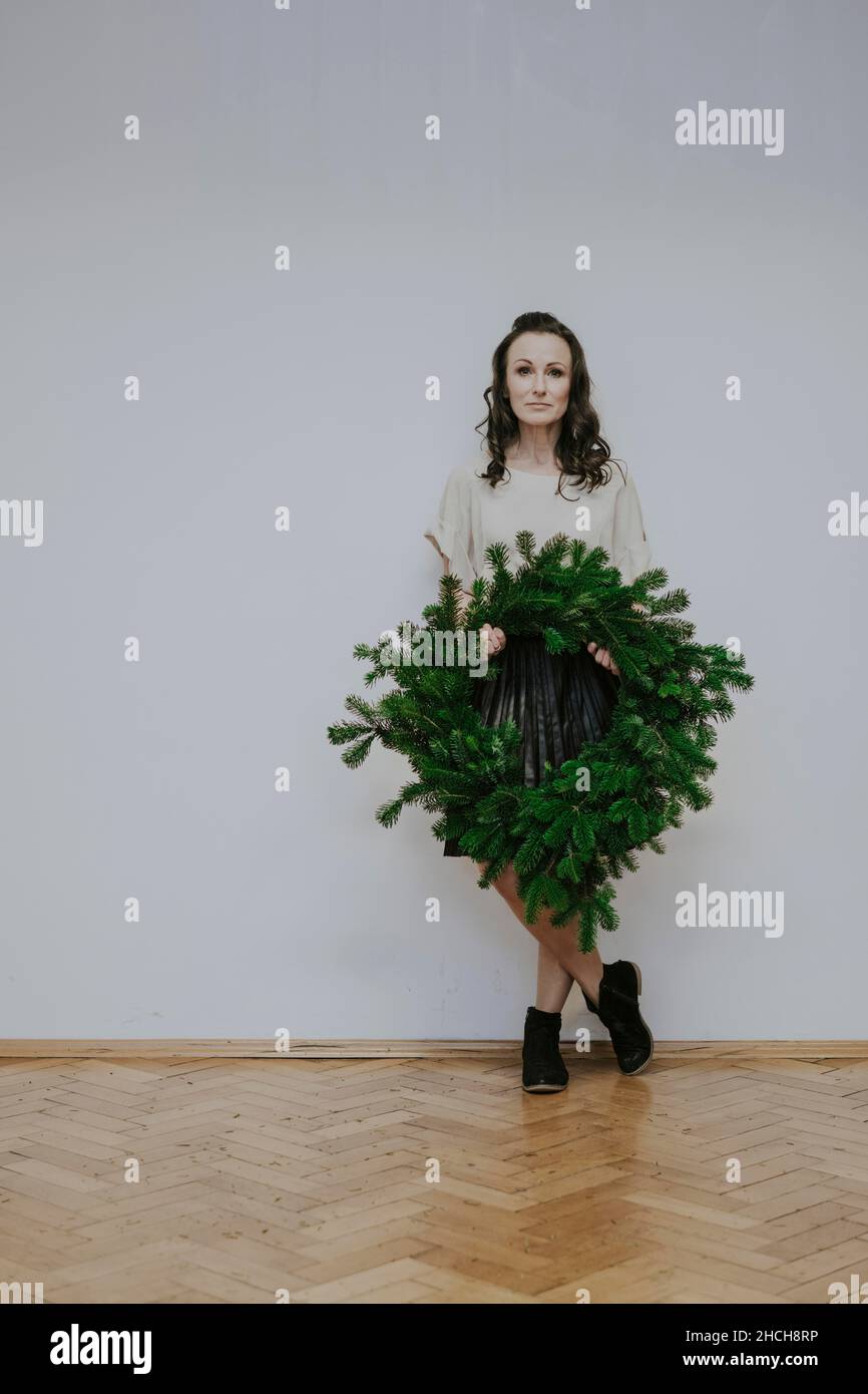Woman with fir wreath Stock Photo