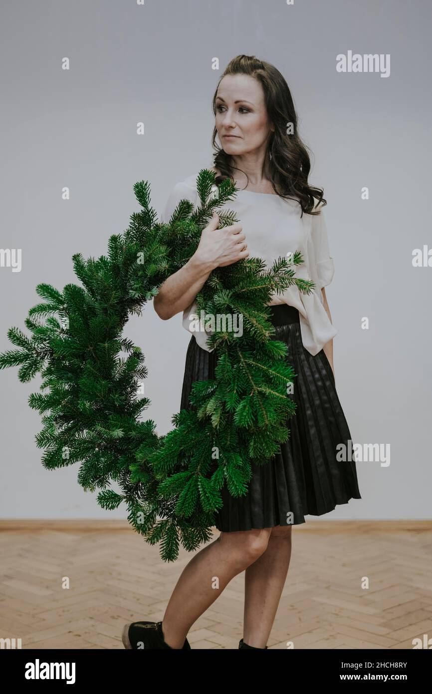 Woman with fir wreath Stock Photo
