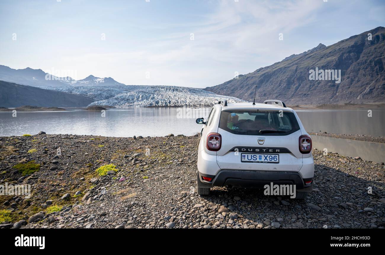 Car standing in front of glacier, Iceland Stock Photo