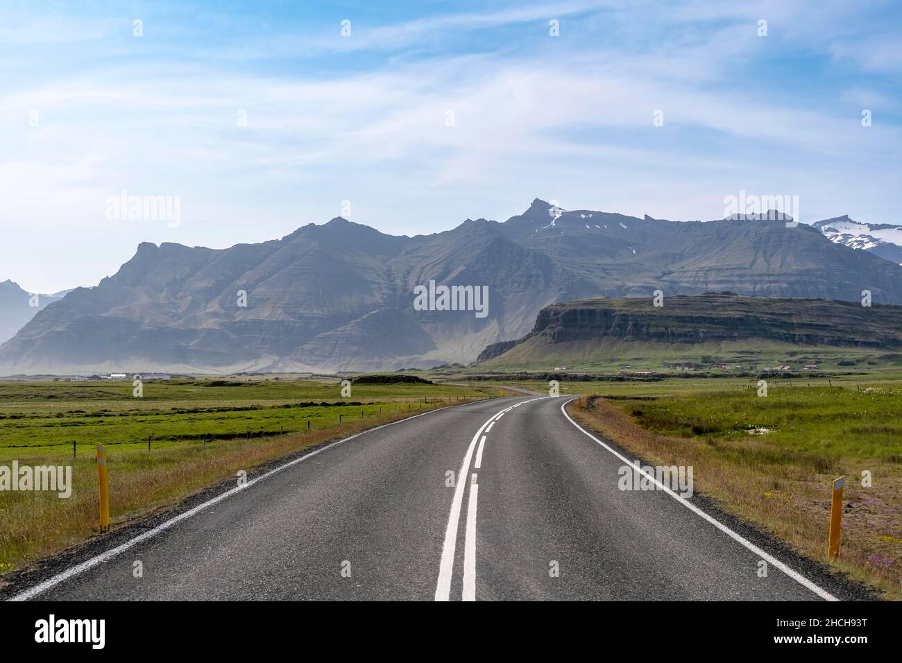Country road, mountain landscape behind, ring road, Iceland Stock Photo