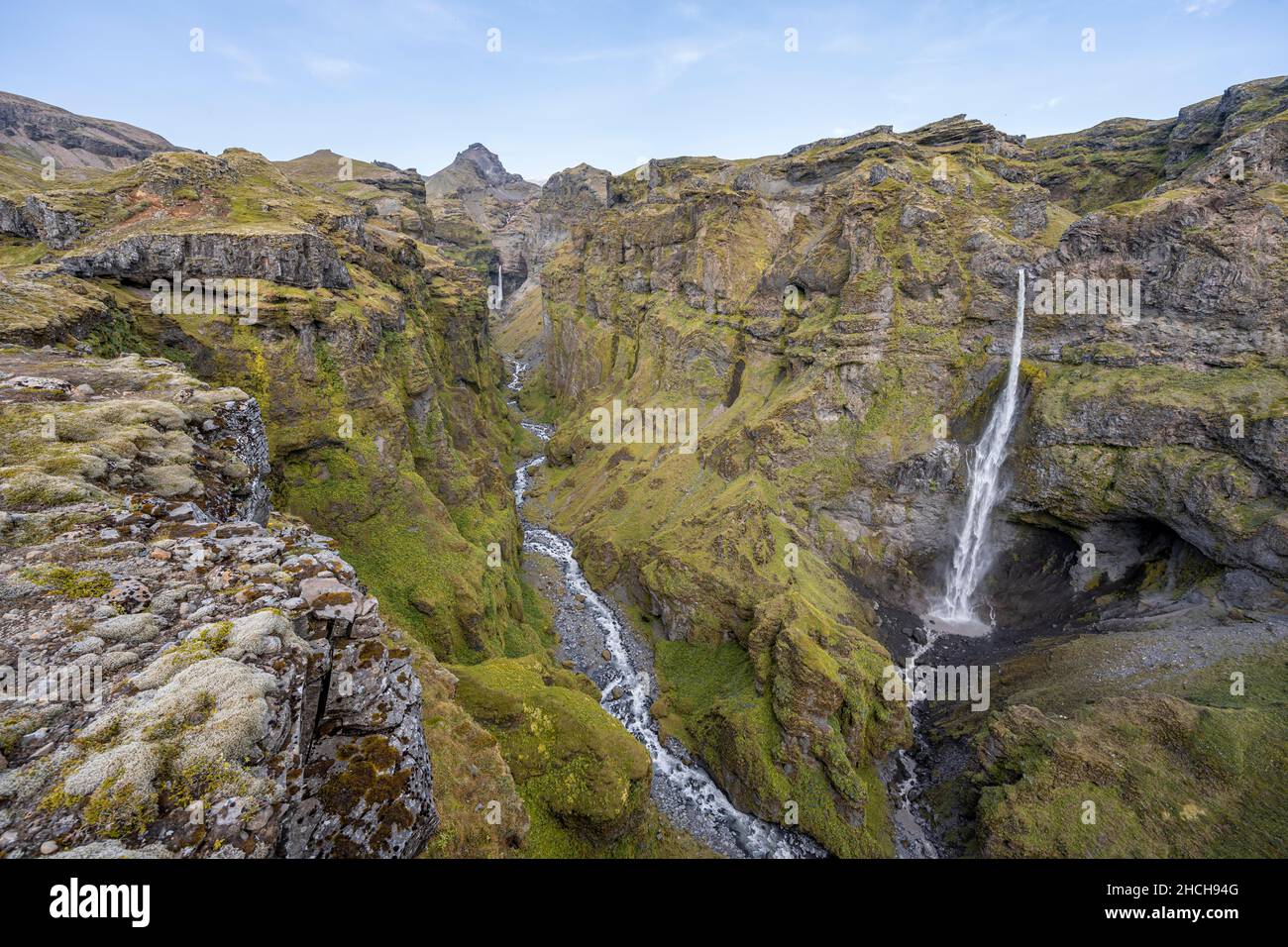 Mountain landscape with canyon, Hangandifoss waterfall in Mulagljufur