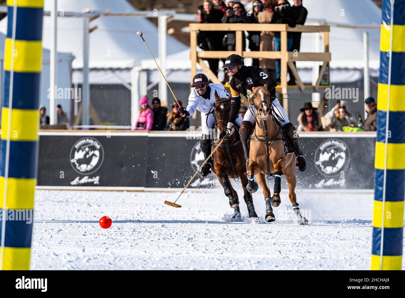 Nic Roldan (black) of Team Badrutt's Palace Hotel fights for the ball ...