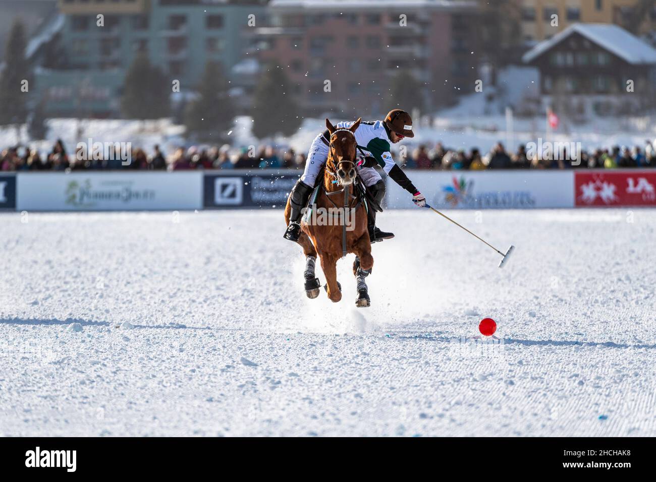 Santiago Marambio of Team Azerbaijan Land of Fire tries to control the ball at full gallop, 36th Snow Polo World Cup St. Moritz 2020, Lake St. Stock Photo
