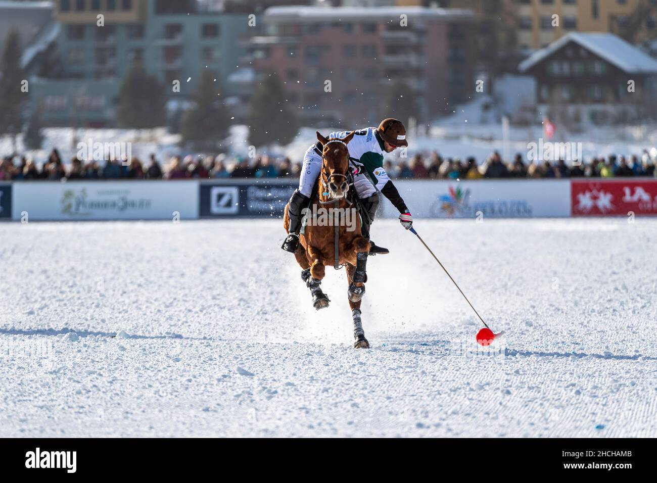 Santiago Marambio of Team Azerbaijan Land of Fire tries to control the ball at full gallop, 36th Snow Polo World Cup St. Moritz 2020, Lake St. Stock Photo