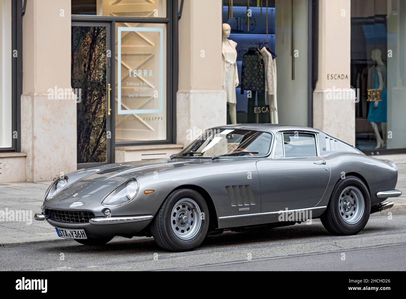 Parked vintage sports car Ferrari 275 GTB4, year of construction 1966 in front of exclusive fashion shop Escada, Maximilianstrasse, Munich, Upper Stock Photo