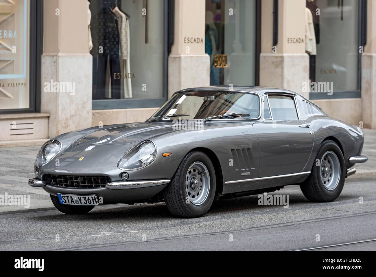 Parked vintage sports car Ferrari 275 GTB4, year of construction 1966 in front of exclusive fashion shop Escada, Maximilianstrasse, Munich, Upper Stock Photo