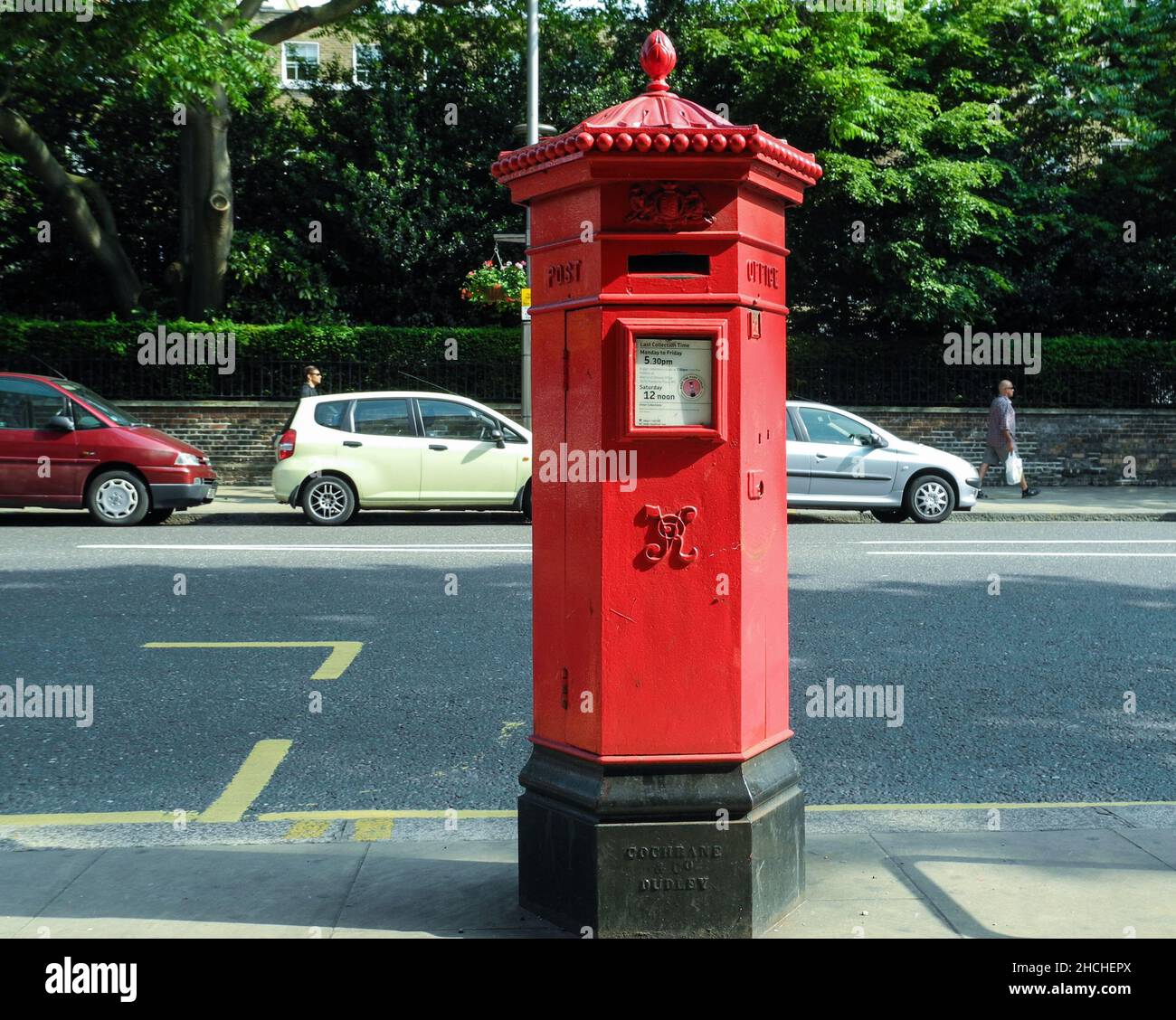 A Victorian Penfold red Post Box on Kensington High Street, England, U