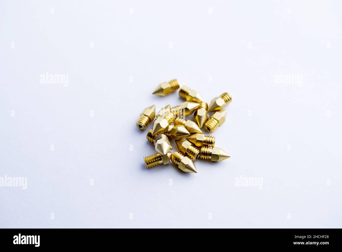 New brass nozzles for 3d printer isolated on white background Stock Photo