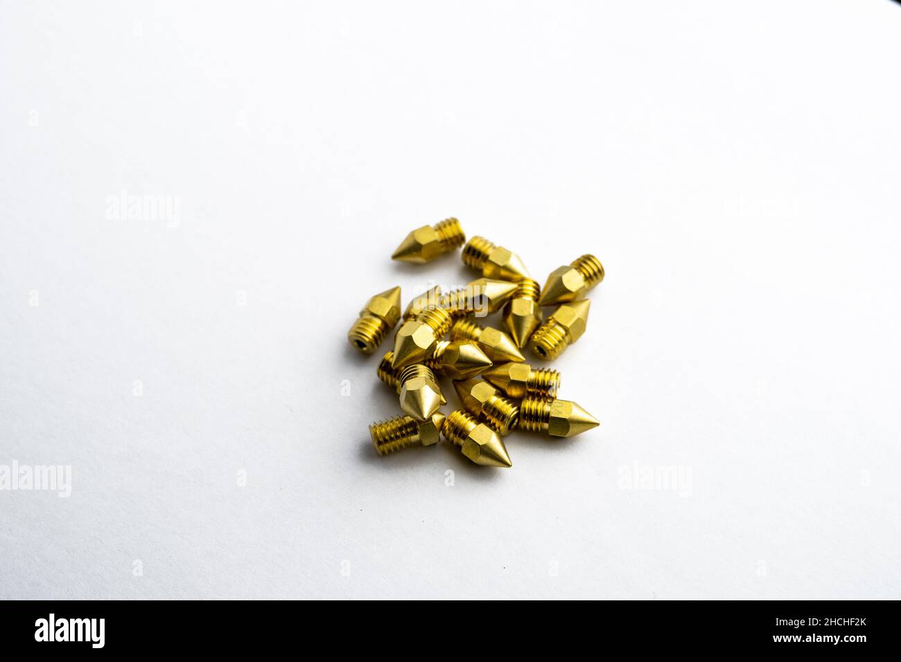 New brass nozzles for 3d printer isolated on white background Stock Photo