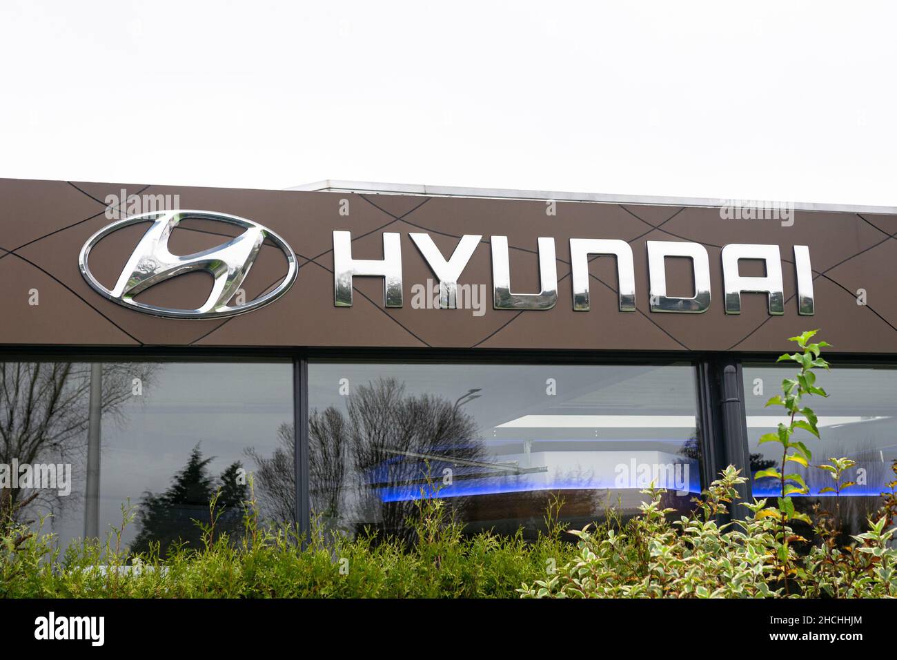 Logo and name of car company Hyundai above the entrance of a car ...