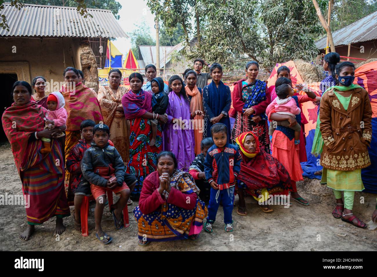 Rajshahi, Bangladesh. 28th Dec, 2021. Santali people posing for a group photo at a wedding in Rajshahi.Santal tribe is an ethnic group native to eastern India. Santals are the largest tribe in the Jharkhand state of India in terms of population and are also found in the states of Assam, Tripura, Bihar, Odisha and West Bengal. They are the largest ethnic minority in northern Bangladesh's Rajshahi Division and Rangpur Division. (Photo by Piyas Biswas/SOPA Images/Sipa USA) Credit: Sipa USA/Alamy Live News Stock Photo