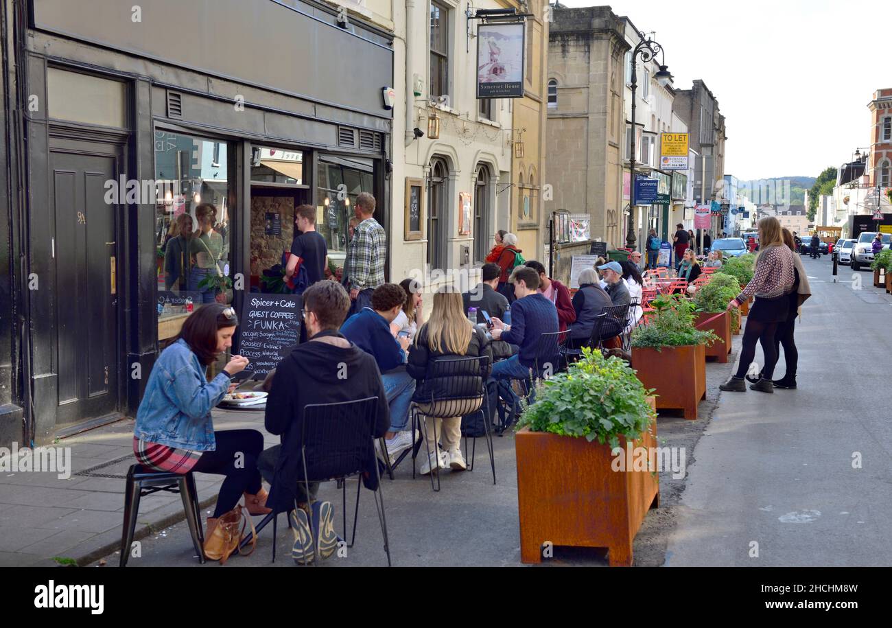 Shops, restaurants along Princes Victoria Street being pedestrianised with planters and eating out along road with tables and chairs, Clifton, Bristol Stock Photo