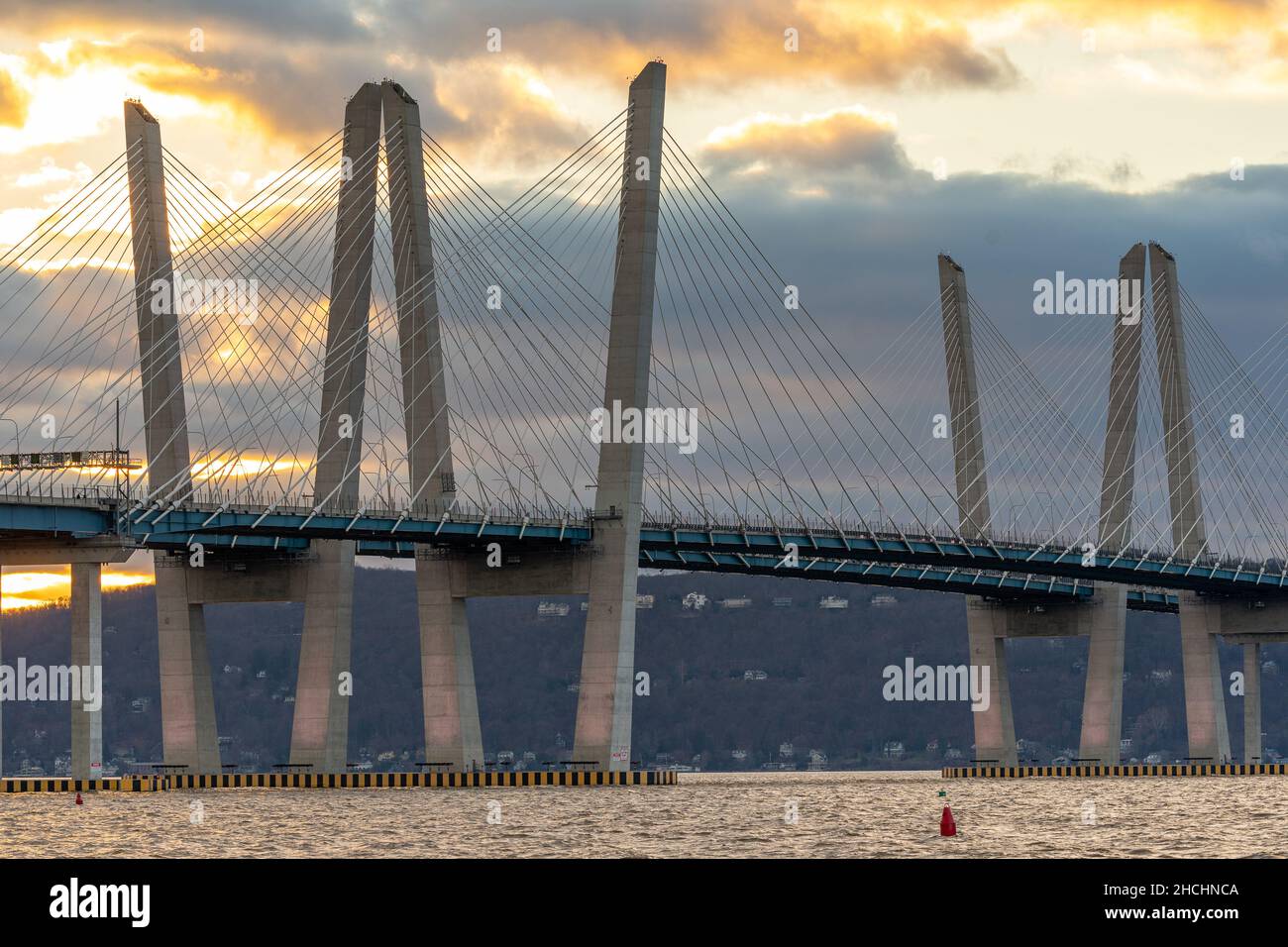 Tarrytown, NY - USA - Dec. 26, 2021: Closeup sunset view of the Governor Mario M. Cuomo Bridge, a twin cable-stayed bridge spanning the Hudson River b Stock Photo